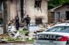 MIKAELA MACKENZIE / FREE PRESS
                                Police on Thursday survey the rubble where a house exploded on Camrose Bay in Transcona on Wednesday.