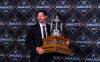 Winnipeg Jets goaltender Connor Hellebuyck holds the Vezina Trophy at hockey’s NHL Awards, Thursday in Las Vegas. (AP Photo/L.E. Baskow)
