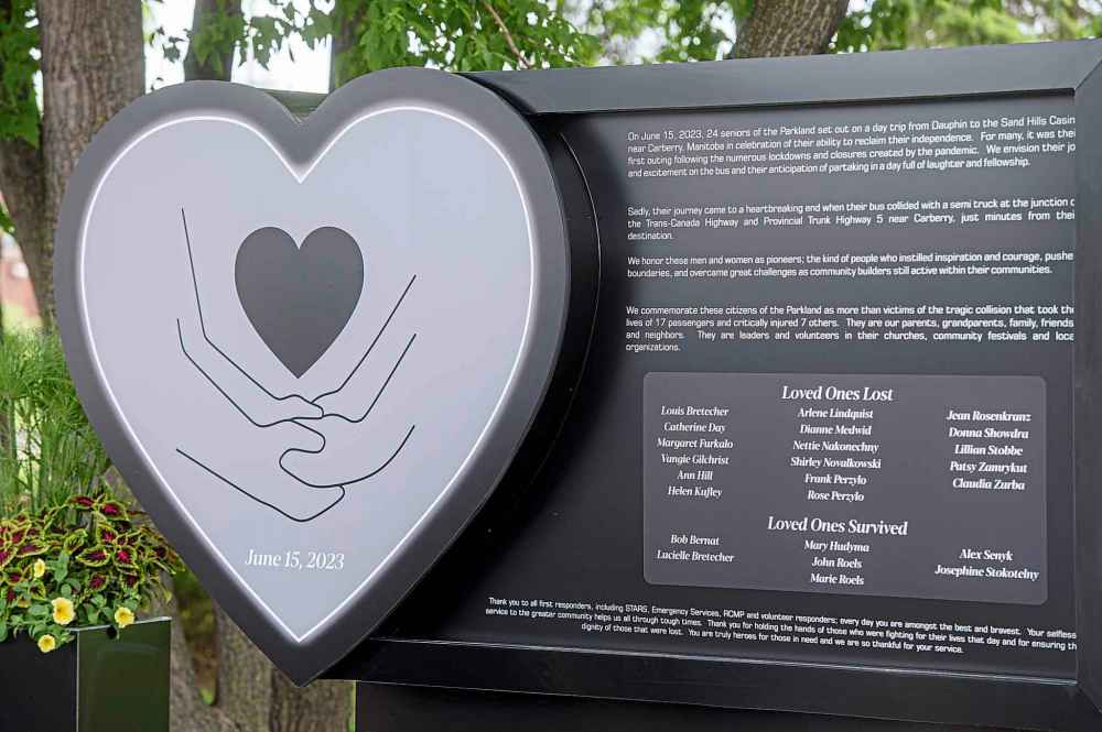 A monument is unveiled as part of a memorial ceremony commemorating the deadly bus crash in Carberry, Man. (Mike Sudoma / The Canadian Press)