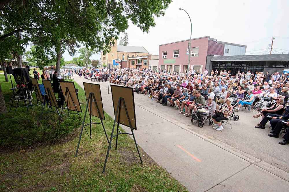 Hundreds of family, friends and community members in Dauphin, Man., attend a memorial ceremony commemorating the deadly bus crash a year ago near Carberry, Man. (Mike Sudoma / The Canadian Press)