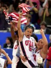 FILE - USA's Dawn Staley (5) and Natalie Williams, right, celebrate the United States victory over Australia in the women's gold medal basketball game at the 2000 Summer Olympic Games in Sydney, Sept. 30, 2000. (AP Photo/Elise Amendola, File)