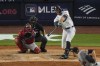 New York Yankees' Giancarlo Stanton, top right, hits a double during the fourth inning of a baseball game against the Atlanta Braves, Saturday, June 22, 2024, in New York. (AP Photo/Frank Franklin II)