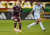 Colorado Rapids midfielder Djordje Mihailovic, left, collects the ball next o CF Montréal defender Fernando Álvarez during the second half of an MLS soccer match Saturday, June 22, 2024, in Commerce City, Colo. (AP Photo/David Zalubowski)
