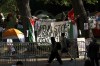 FILE - People walk past the Gaza Solidarity Encampment at the University of Pennsylvania in Philadelphia, Tuesday, April 30, 2024. In the wake of pro-Palestinian protesters on college campuses calling for universities to divest from Israel, Pennsylvania’s state Senate on Thursday, June 27, 2024, approved legislation that would block state aid from going to any university that boycotts or divests from Israel. (Monica Herndon/The Philadelphia Inquirer via AP, File)