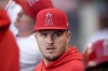 Los Angeles Angels center fielder Mike Trout sits in the dugout during the first inning of the team's baseball game against the Oakland Athletics, Tuesday, June 25, 2024, in Anaheim, Calif. (AP Photo/Ryan Sun)