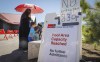People lineup at a splash park ti try and beat the heat in Calgary, Alta., Wednesday, June 30, 2021. THE CANADIAN PRESS/Jeff McIntosh