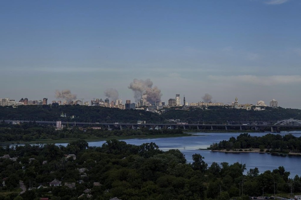 Smoke rises over the Kyiv skyline after a Russian attack, Monday, July 8, 2024. Russian forces launched multiple ballistic and cruise missiles against Ukrainian targets on Monday, Ukraine’s air force said, with explosions felt and heard across the capital, Kyiv. (AP Photo/ Evgeniy Maloletka)