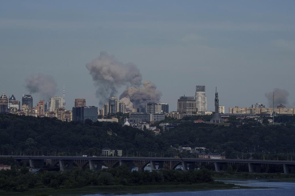 Smoke rises over the Kyiv skyline after a Russian attack, Monday, July 8, 2024. Russian forces launched multiple ballistic and cruise missiles against Ukrainian targets on Monday, Ukraine’s air force said, with explosions felt and heard across the capital, Kyiv. (AP Photo/ Evgeniy Maloletka)