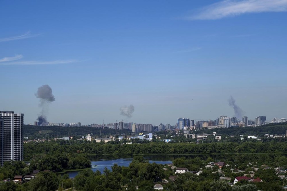Smoke rises over the Kyiv skyline after a Russian attack, Monday, July 8, 2024. Russian forces launched multiple ballistic and cruise missiles against Ukrainian targets on Monday, Ukraine’s air force said, with explosions felt and heard across the capital, Kyiv. (AP Photo/ Evgeniy Maloletka)