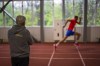 Coach Hennadii Zditovetskyi, left, watches high jumper Oleh Doroshchuk during a training session at a regional youth sport school for the Olympics, in Kropyvnytskyi, Ukraine, Thursday, April 18, 2024. Doroshchuk, one of Ukraine’s brightest prospects in Olympic track and field in Paris, has learned to ignore aid raid sirens that blare over his hometown in central Ukraine, so they don’t interrupt his training. (AP Photo/Francisco Seco)