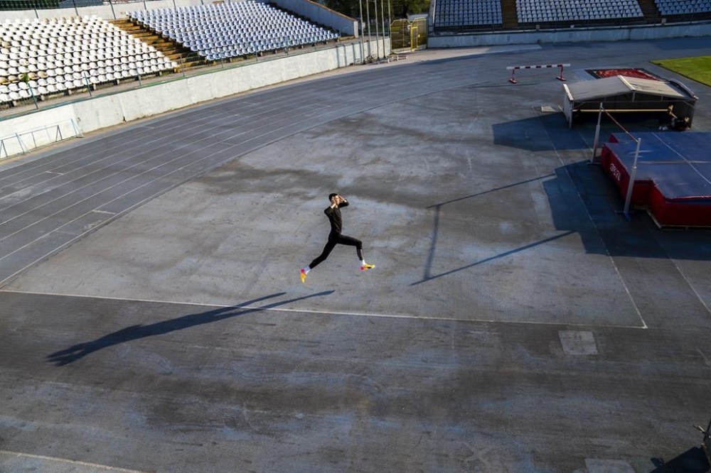 High jumper Oleh Doroshchuk works out during a training session at Zirka stadium, in Kropyvnytskyi, Ukraine, Friday, April 19, 2024. (AP Photo/Francisco Seco)