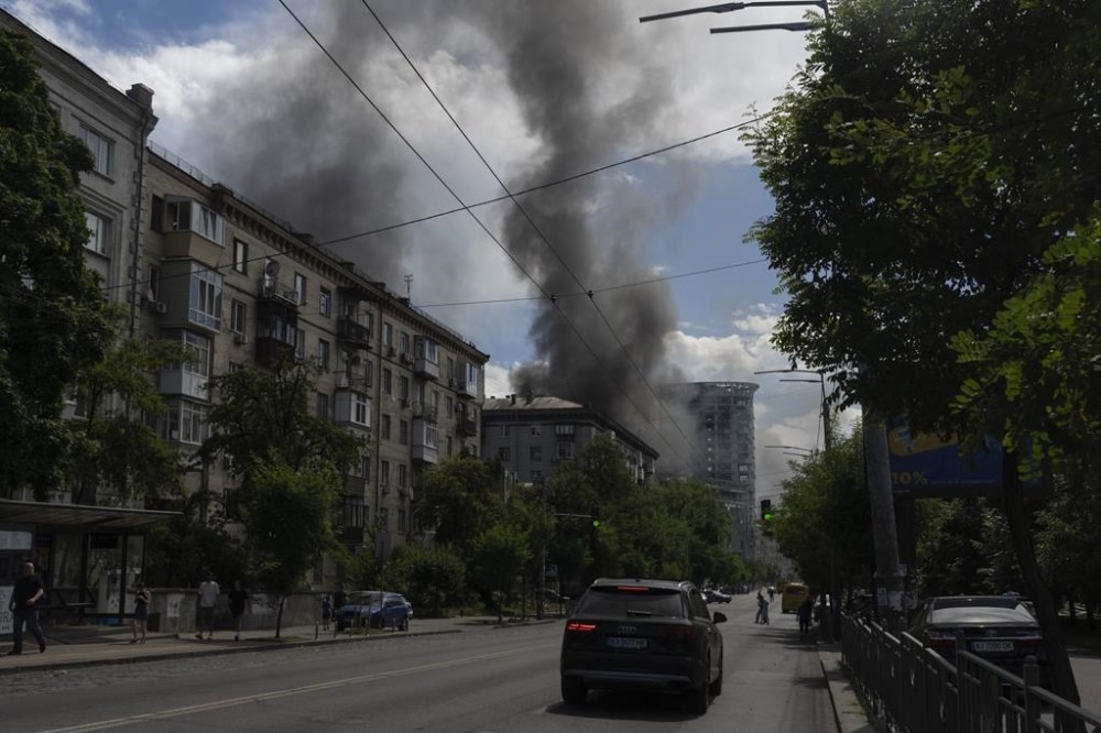 Smoke rises up after Russia's massive missile attack in central Kyiv, Ukraine, Monday, July 8, 2024. A major Russian missile attack across Ukraine killed at least 20 people and injured more than 50 on Monday, officials said, with one missile striking a large children’s hospital in the capital, Kyiv, where emergency crews searched rubble for casualties. (AP Photo/Efrem Lukatsky)