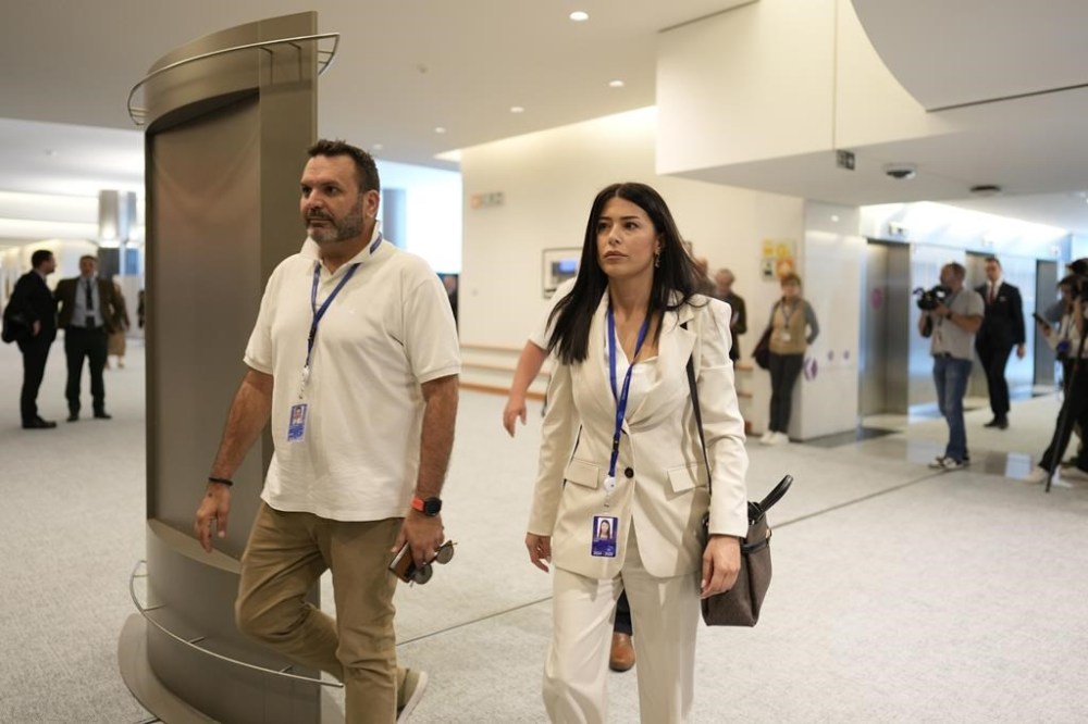 Greek politician Afroditi Latinopoulou, right, arrives for a meeting at the European Parliament in Brussels, Monday, July 8, 2024. Senior officials of right-wing parties from Hungary and France met with allies from Austria, Belgium, the Czech Republic, the Netherlands, Portugal and Spain to discuss the formation of a new political group in the European Parliament, the Patriots of Europe. (AP Photo/Virginia Mayo)