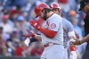 St. Louis Cardinals' Alec Burleson, left, celebrates after his home run during the eighth inning of a baseball game against the Washington Nationals, Monday, July 8, 2024, in Washington. (AP Photo/Nick Wass)