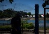A runner cools off at a misting station in Vancouver on July 7, 2024. THE CANADIAN PRESS/Ethan Cairns