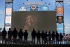 The Cubs stand during a tribute to Willie Mays on the video screen before a baseball game between the Chicago Cubs and San Francisco Giants, Monday, June 24, 2024. The pre-game tribute for former San Francisco Giant and baseball Hall of Famer Willie Mays was to honor him after he passed away a week earlier.(Carlos Avila Gonzalez/San Francisco Chronicle via AP)