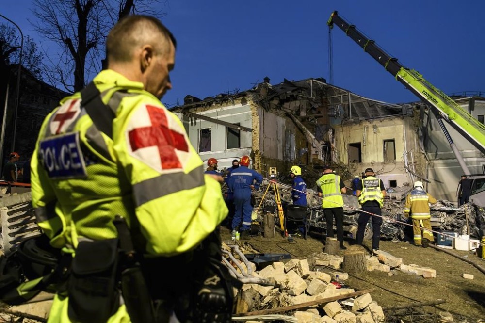 Rescuers are working at Ohmatdyt Children's Hospital that is strongly damaged during a Russian missile strike in Kyiv, Ukraine, on July 08, 2024, amid the Russian invasion. Russia is massively attacking Ukraine with missiles on 08 July. (Photo by Maxym Marusenko/NurPhoto via AP)