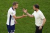 England's manager Gareth Southgate embraces England's Harry Kane after Kane is substituted off during a quarterfinal match between England and Switzerland at the Euro 2024 soccer tournament in Duesseldorf, Germany, Saturday, July 6, 2024. (AP Photo/Hassan Ammar)