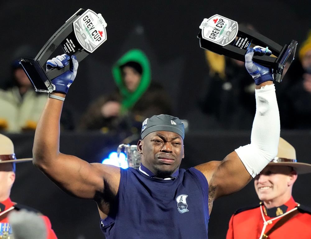 Toronto Argonauts linebacker Henoc Muamba celebrates after being named the Grey Cup's Most Valuable Player and Most Valuable Canadian after defeating the Winnipeg Blue Bombers in the 109th Grey Cup at Mosaic Stadium in Regina, Sunday, Nov. 20, 2022. Muamba didn't have much use for his degree in information systems over the course of his 12-year CFL career but now that he's retired from playing, he's finally getting to put his education to use.THE CANADIAN PRESS/Frank Gunn