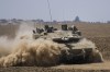 Israel-based defence contractor Elbit Security Systems Ltd. is taking the Canadian government to court after the company was dropped from the running for a multimillion-dollar military equipment contract. Israeli soldiers drive a tank near the Israel-Gaza border, in southern Israel, Wednesday, June 5, 2024. THE CANADIAN PRESS/AP/Tsafrir Abayov