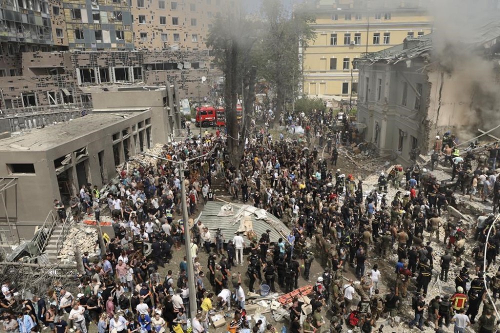 Rescuers and volunteers clean up the rubble and search for victims after a Russian missile hit the country's main children hospital Okhmadit in Kyiv, Ukraine, Monday, July 8, 2024. The daytime barrage targeted five Ukrainian cities with more than 40 missiles of different types hitting apartment buildings and public infrastructure, President Volodymyr Zelenskyy said on social media. (AP Photo/Anton Shtuka)