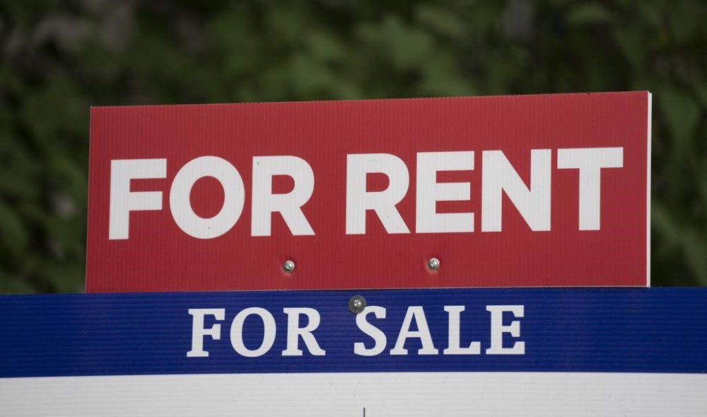 A new report says the average asking rent for a home in Canada reached $2,185 in June, up seven per cent compared with a year ago despite representing the slowest annual rate of growth in 13 months. A realtor's sign advertising a house as for sale or for rent is shown in Ottawa on June 9, 2023. THE CANADIAN PRESS/Adrian Wyld