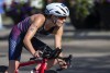 FILE - Taylor Knibb, of the United States, rides during the elite women's ITU World Triathlon Series in Edmonton, Alberta, Saturday, Aug. 21, 2021. Knibb resigned her position on the U.S. team for the road race at the Paris Olympics on Tuesday, July 9, 2024, and will be replaced by Kristen Faulkner, who already had been picked to compete with the American pursuit squad in the velodrome. (Jason Franson/The Canadian Press via AP, File)