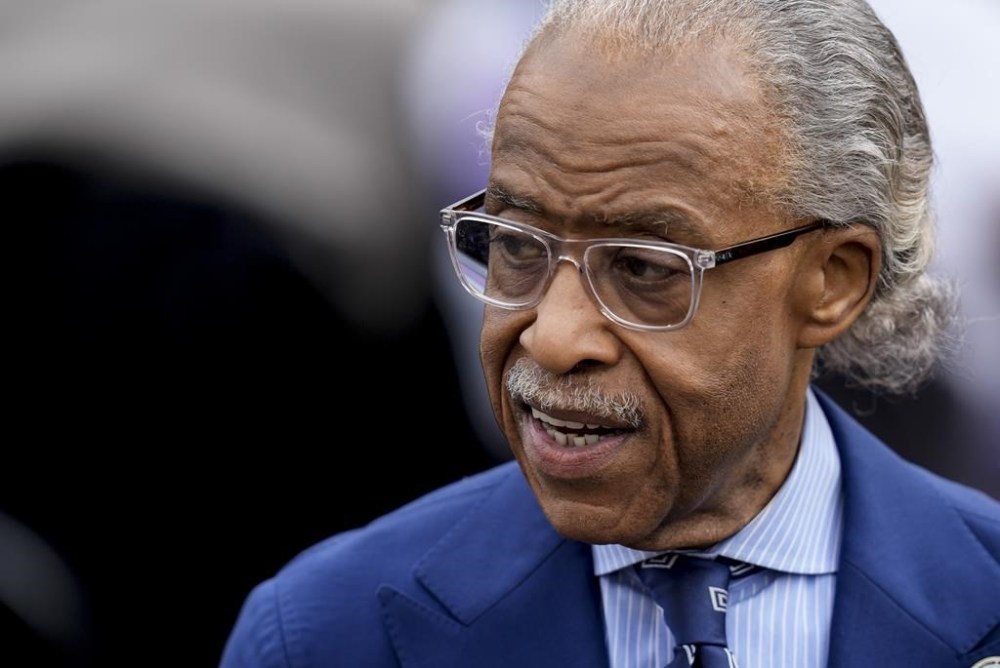 FILE - Al Sharpton waits for Vice President Kamala Harris to speak before walking across the Edmund Pettus Bridge commemorating the 59th anniversary of the Bloody Sunday voting rights march in 1965, March 3, 2024, in Selma, Ala. Sharpton, who serves on the U.S. Commission on Civil Rights, said in a news release Tuesday, July 9, that he'll speak Thursday, July 11, at the funeral of Dvontaye Mitchell, a Black man who died after a confrontation with hotel security guards last month. (AP Photo/Mike Stewart, File)