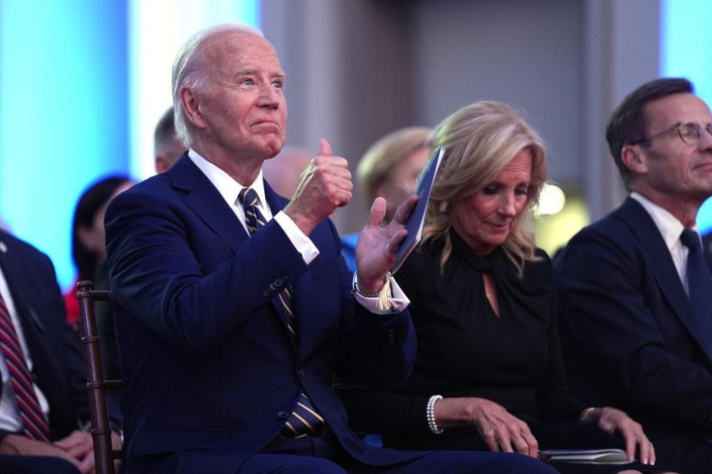 President Joe Biden, left, and first lady Jill Biden sit in the audience before Biden delivers remarks on the 75th anniversary of NATO at the Andrew W. Mellon Auditorium, Tuesday, July 9, 2024, in Washington. (AP Photo/Evan Vucci)