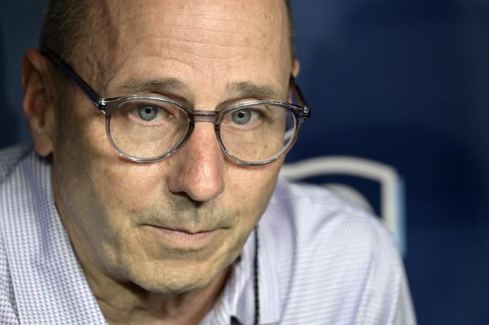 New York Yankees general manager Brian Cashman meets with reporters in the dugout before a baseball game against the Tampa Bay Rays, Tuesday, July 9, 2024, in St. Petersburg, Fla. (AP Photo/Steve Nesius)
