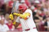 Cincinnati Reds' Noelvi Marte is hit by a pitch during the second inning of a baseball game against the Colorado Rockies, Tuesday, July 9, 2024, in Cincinnati. (AP Photo/Jeff Dean)