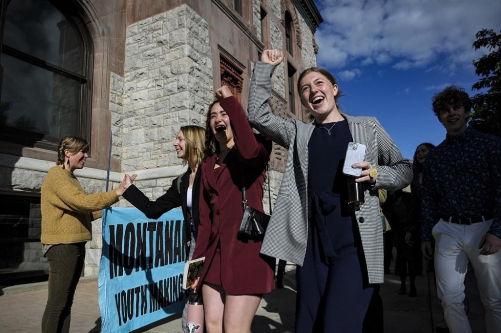 FILE - Youth plaintiffs in the climate change lawsuit, Held vs. Montana, arrive at the Lewis and Clark County Courthouse, June 20, 2023, in Helena, Mont., for the final day of the trial. A Montana judge in August 2023 sided with young environmental activists who said state agencies were violating their constitutional right to a clean and healthful environment by permitting fossil fuel development without considering its effect on the climate. The state's effort to overturn the ruling is now before the Montana Supreme Court. (Thom Bridge/Independent Record via AP, File)/Independent Record via AP)