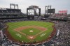 Fans and players stand during a moment of silence for New York Mets Chief Photographer Marc Levine before a baseball game between the New York Mets and the Washington Nationals, Tuesday, July 9, 2024, in New York. Levine passed away on Thursday, July 4. (AP Photo/Frank Franklin II)