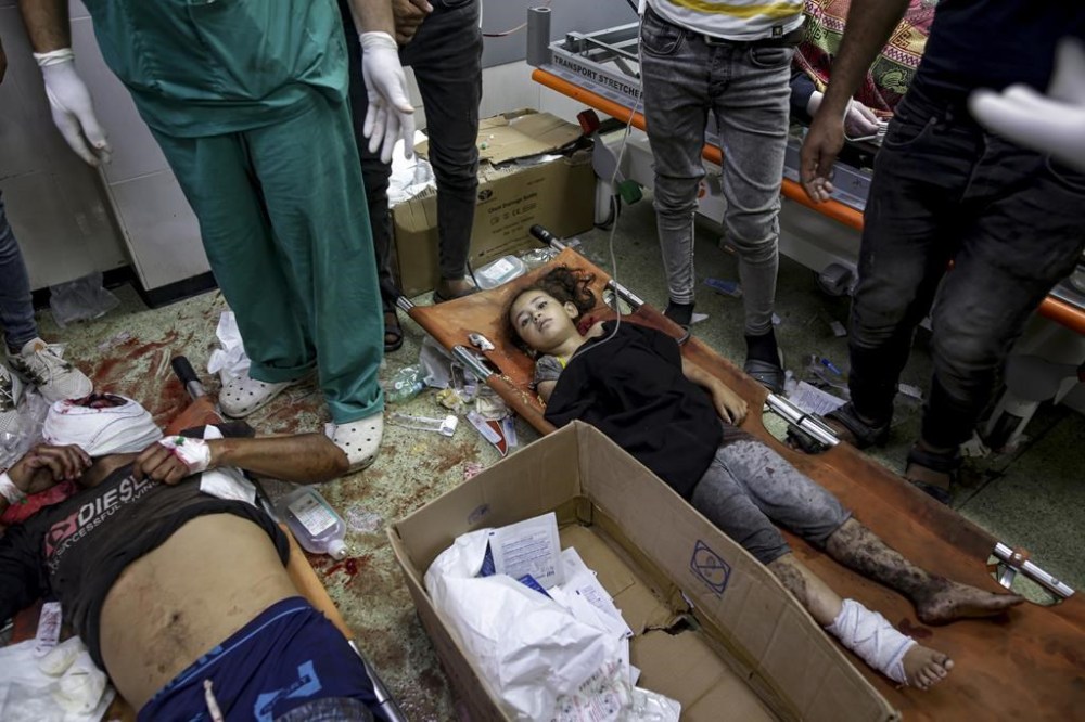 Palestinians wounded in the Israeli bombardment of the Gaza Strip are treated in a hospital in Khan Younis, Tuesday, July 9, 2024. (AP Photo/Jehad Alshrafi)