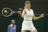 Danielle Collins plays a forehand return to Barbora Krejcikova of the Czech Republic during their fourth round match at the Wimbledon tennis championships in London, Monday, July 8, 2024. (AP Photo/Alberto Pezzali)
