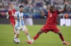 Argentina's Lionel Messi, left, vies for the ball with Canada's Derek Cornelius during a Copa America semifinal soccer match in East Rutherford, N.J., Tuesday, July 9, 2024. After losing to top-ranked Argentina for a second time at Copa America, the 48th-ranked Canadian men turn their attentions to Saturday's third-place game against either No. 12 Colombia or No. 14 Uruguay. For coach Jesse Marsch, it's another step on the road to the 2026 World Cup with plenty of progress already.THE CANADIAN PRESS/AP/Julia Nikhinson