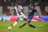 FILE - Nice's Khephren Thuram, left, challenges for the ball with Cologne's Ondrej Duda during the Europa Conference League Group D match between OCG Nice and FC Koln, in Nice, France, on Sept. 8, 2022. Khephren Thuram signed with his father’s former club Juventus on Wednesday, joining brother Marcus in Serie A. (AP Photo/Daniel Cole, File)