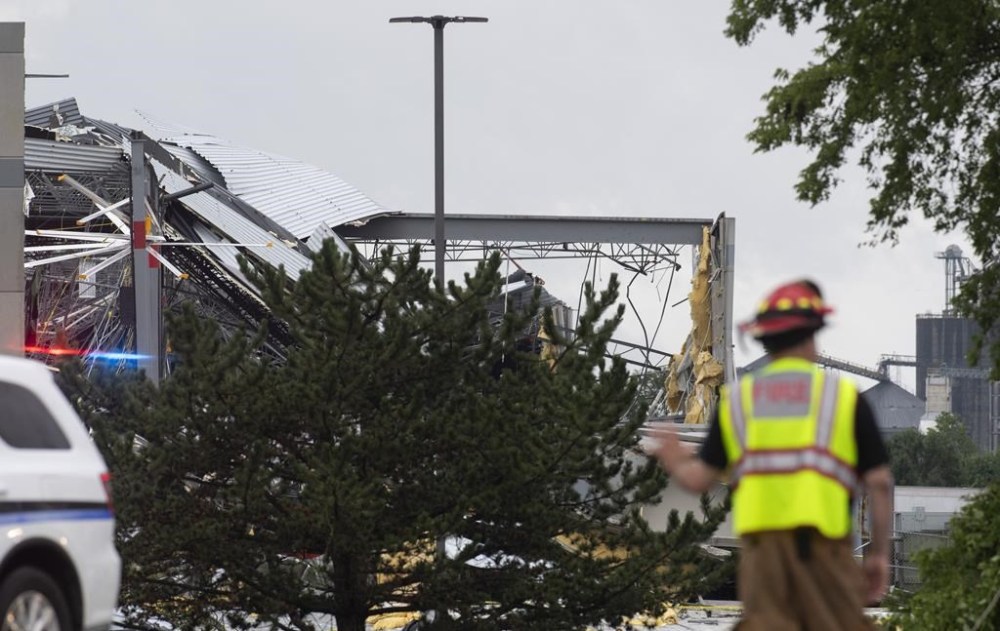 Emergency personnel survey damage after an apparent tornado hit a warehouse at Kenco Logistics in Mount Vernon, Ind., Tuesday, July 9, 2024.(MaCabe Brown/Evansville Courier & Press via AP)