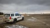 A defence lawyer for one of two men accused of conspiracy to commit murder at the border blockade at Coutts, Alta., has suggested many of the guns seized by police are rifles used for hunting small game. A police vehicle is parked after the blockade of the highway ended at the busy Canada-U.S. border crossing in Coutts, Alta., Tuesday, Feb. 15, 2022.THE CANADIAN PRESS/Jeff McIntosh