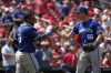 Kansas City Royals relief pitcher James McArthur (66) and catcher Salvador Perez celebrate a 6-4 victory over the St. Louis Cardinals in the first game of a baseball doubleheader Wednesday, July 10, 2024, in St. Louis. (AP Photo/Jeff Roberson)