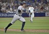 New York Yankees' Ben Rice circles the bases after hitting a two-run home run off Tampa Bay Rays reliever Colin Poche, right, during the seventh inning of a baseball game Tuesday, July 9, 2024, in St. Petersburg, Fla. (AP Photo/Steve Nesius)