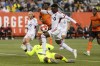 Toronto FC midfielder Derrick Etienne (11) jumps over Forge FC goalkeeper Christopher Kalongo (29) during first half Canadian Championship semifinal action in Hamilton, Ont., on Wednesday, July 10, 2024. THE CANADIAN PRESS/Nick Iwanyshyn