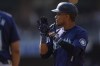 Seattle Mariners' Jorge Polanco celebrates after hitting an RBI single during the fourth inning of a baseball game against the San Diego Padres, Wednesday, July 10, 2024, in San Diego. (AP Photo/Gregory Bull)