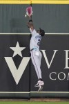 Miami Marlins center fielder Jazz Chisholm Jr. leaps but misses an RBI double by Houston Astros' Jake Meyers during the second inning of a baseball game Wednesday, July 10, 2024, in Houston. (AP Photo/Kevin M. Cox)