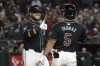 Arizona Diamondbacks' Eugenio Suárez, left, celebrates with Alek Thomas (5) after hitting a two-run home run against the Atlanta Braves in the second inning during a baseball game Wednesday, July 10, 2024, in Phoenix. (AP Photo/Rick Scuteri)