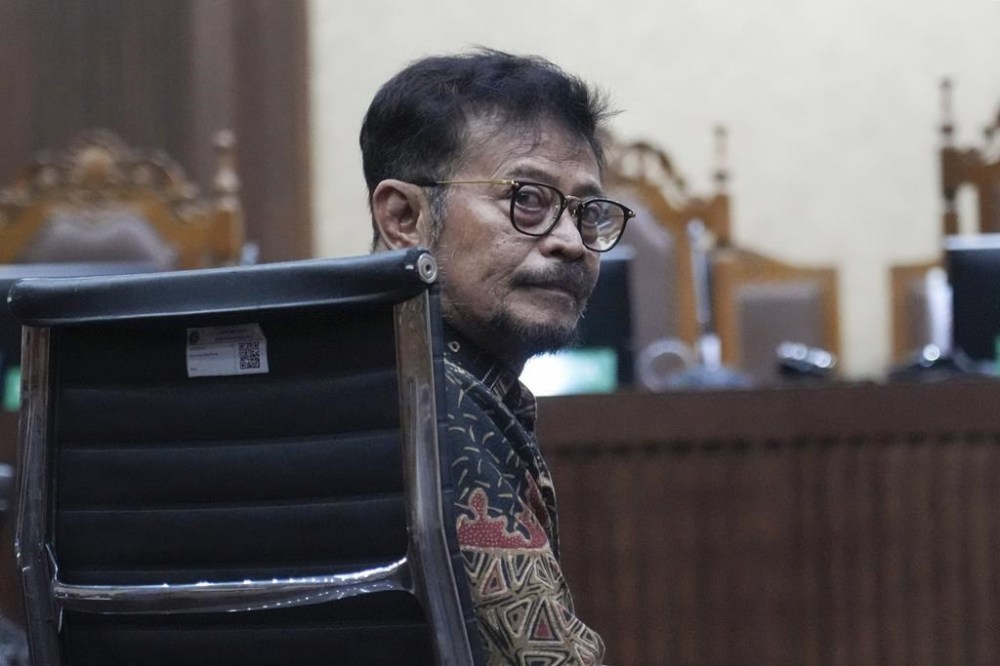 Former Indonesian Agriculture Minister Syahrul Yasin Limpo sits on the defendant's chair prior to the start of his sentencing hearing on a corruption case at the Corruption Court in Jakarta, Indonesia Thursday, July 11, 2024. Indonesia’s anti-graft court sentenced the former agriculture minister to 10 years in prison Thursday after finding him guilty of corruption-related extortion, abuse of power and bribery involving ministry contracts with private vendors. (AP Photo/Tatan Syuflana)