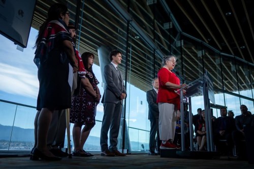 Minister of Fisheries, Oceans and the Canadian Coast Guard, Diane Lebouthillier, right, speaks during a news conference as Prime Minister Justin Trudeau listens in Vancouver on June 25, 2024. First Nations along British Columbia's coast have announced with the Canadian government the designation of the country's largest marine protected area. A statement issued by Fisheries and Oceans Canada says the ecologically unique ocean area is located about 150 kilometres of the west coast of Vancouver Island. THE CANADIAN PRESS/Ethan Cairns