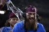 Philadelphia Phillies' Brandon Marsh is doused by Bryson Stott after the Phillies won a baseball game against the Los Angeles Dodgers, Thursday, July 11, 2024, in Philadelphia. (AP Photo/Matt Slocum)
