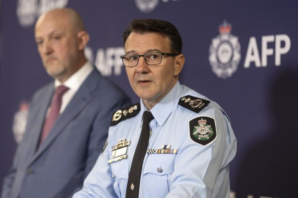 In this photo provided by the Australian Federal Police, Australian Federal Police Commissioner Reece Kershaw speaks Friday, July 12, 2024, in Canberra, about the arrest of an Australian army private and her husband, accused of spying for Russia. The 42-year-old woman, an Australian Defense Force information systems technician, and her 62-year-old husband, a self-employed laborer, are each charged with one count of preparing for an espionage offense, Kershaw said. (Australian Federal Police via AP)