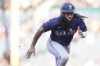 Seattle Mariners' J.P. Crawford runs to third base during the first inning of a baseball game against the Los Angeles Angels in Anaheim, Calif., Thursday, July 11, 2024. (AP Photo/Eric Thayer)